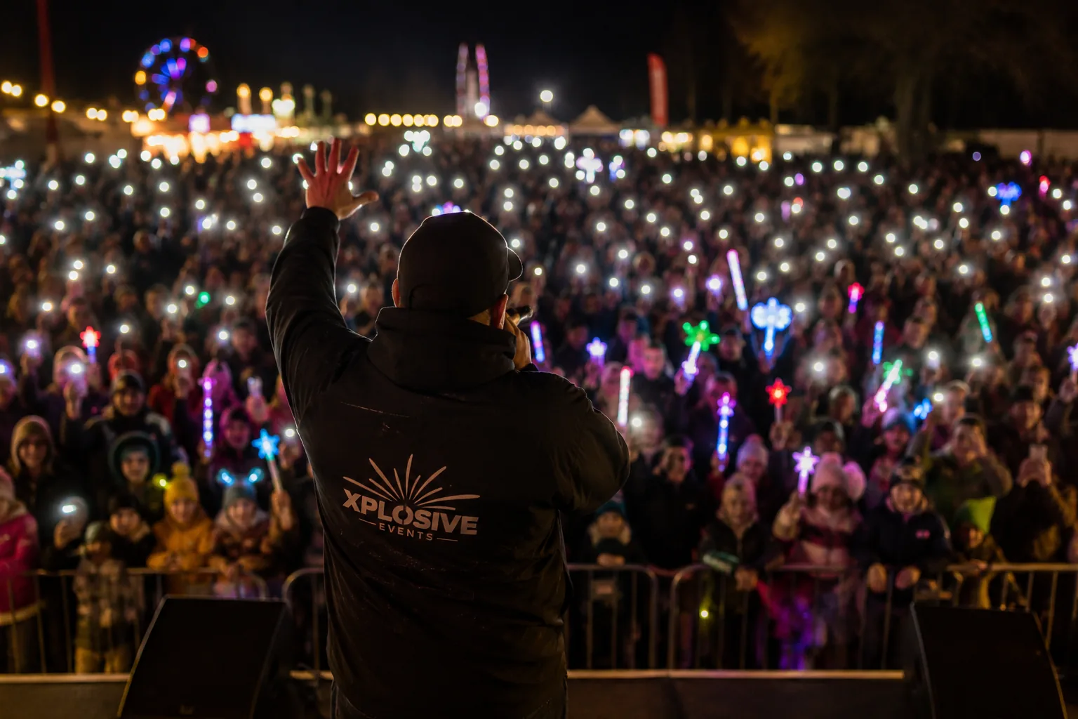 Festival stage lights and crowd cheering at Ardingly